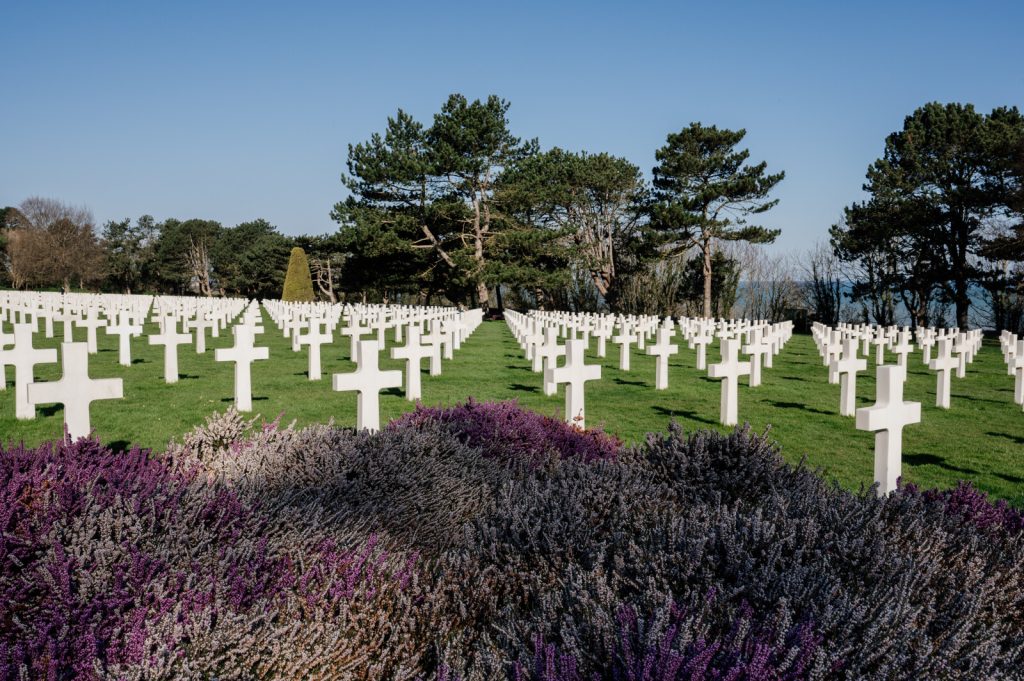 Rows of white headstones at the Normandy American Cemetery above Omaha Beach